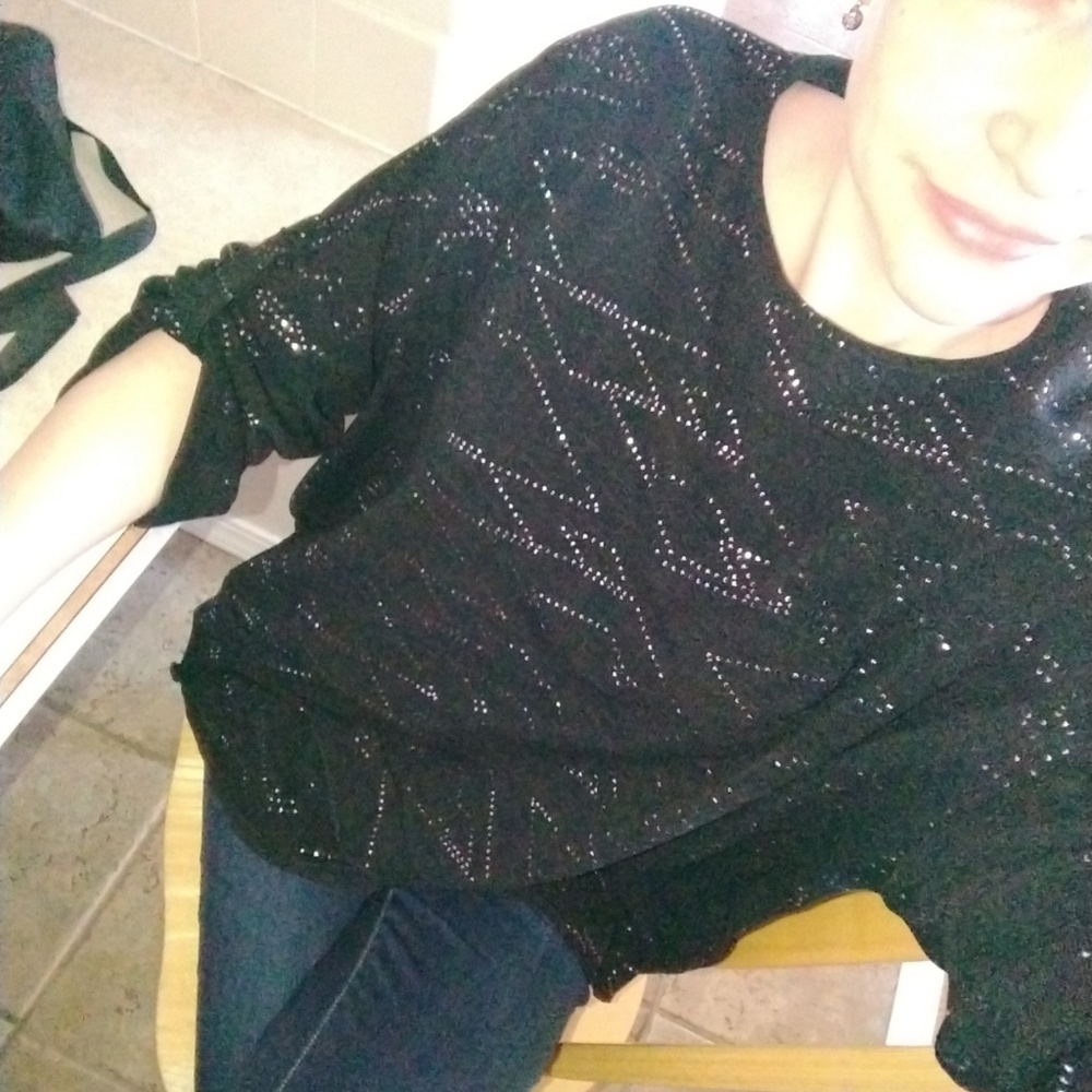 Large black sweater with shiny silver detail